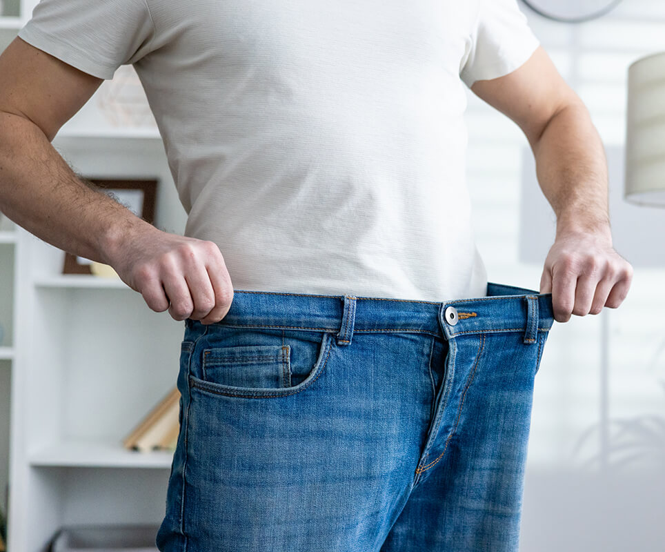 man-showing-weight-loss-by-wearing-loose-jeans-in-2025-03-25-05-08-48-utc (2) (1)